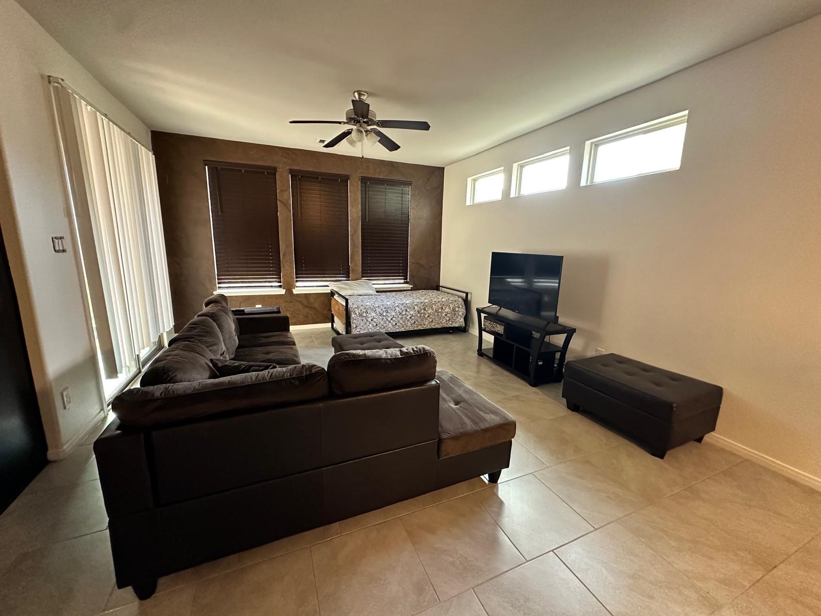 3322 Harvest Meadow Lane Rosenberg, TX 77471 - Photo 3 of 39 a living room with furniture and a flat screen tv