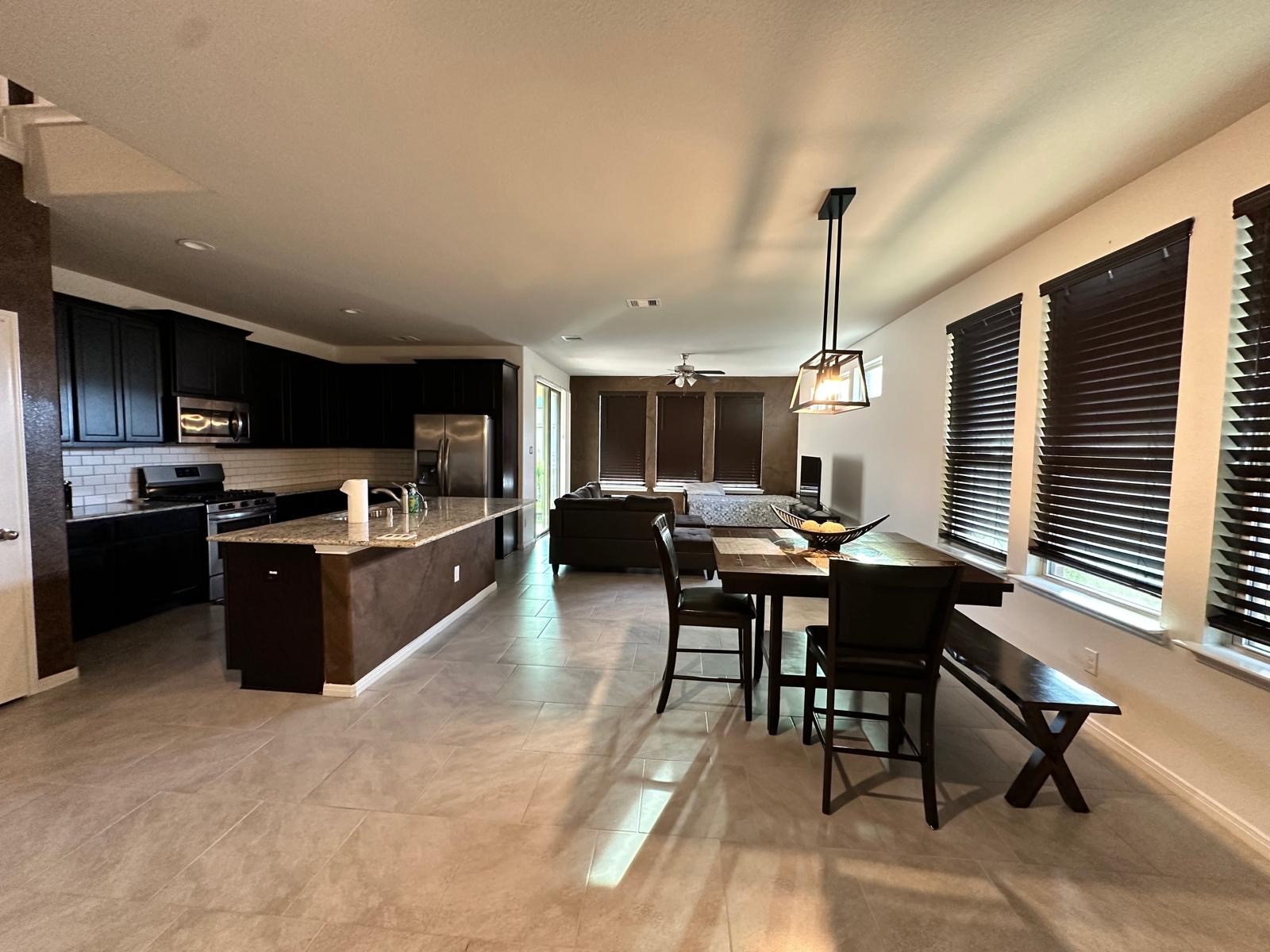 3322 Harvest Meadow Lane Rosenberg, TX 77471 - Photo 5 of 39 a kitchen with a table and chairs in it