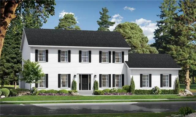 a front view of a house with a garden and trees