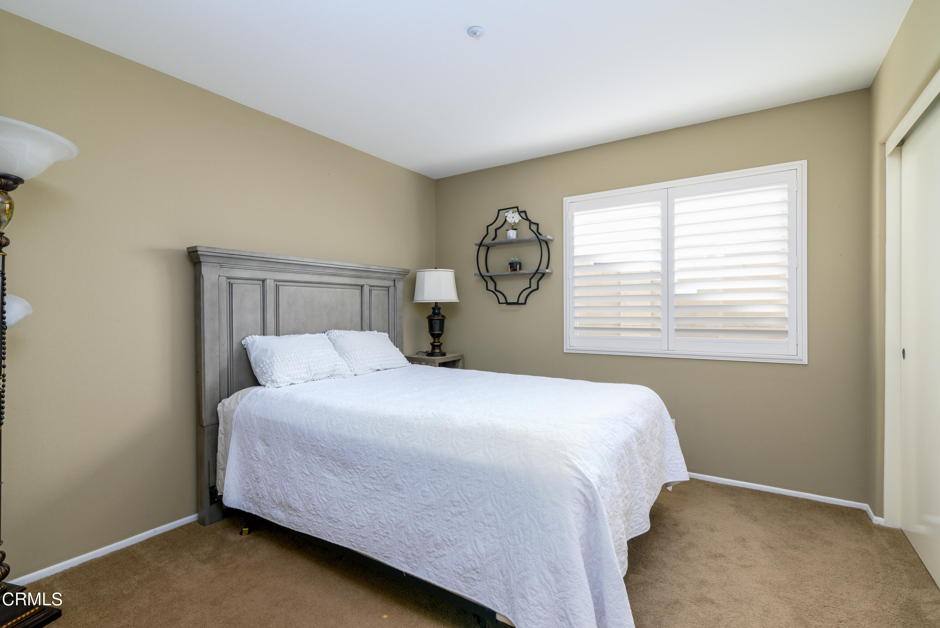 2111 Orlop Place Oxnard, CA 93035 - Photo 21 of 26 a bedroom with a bed and a window