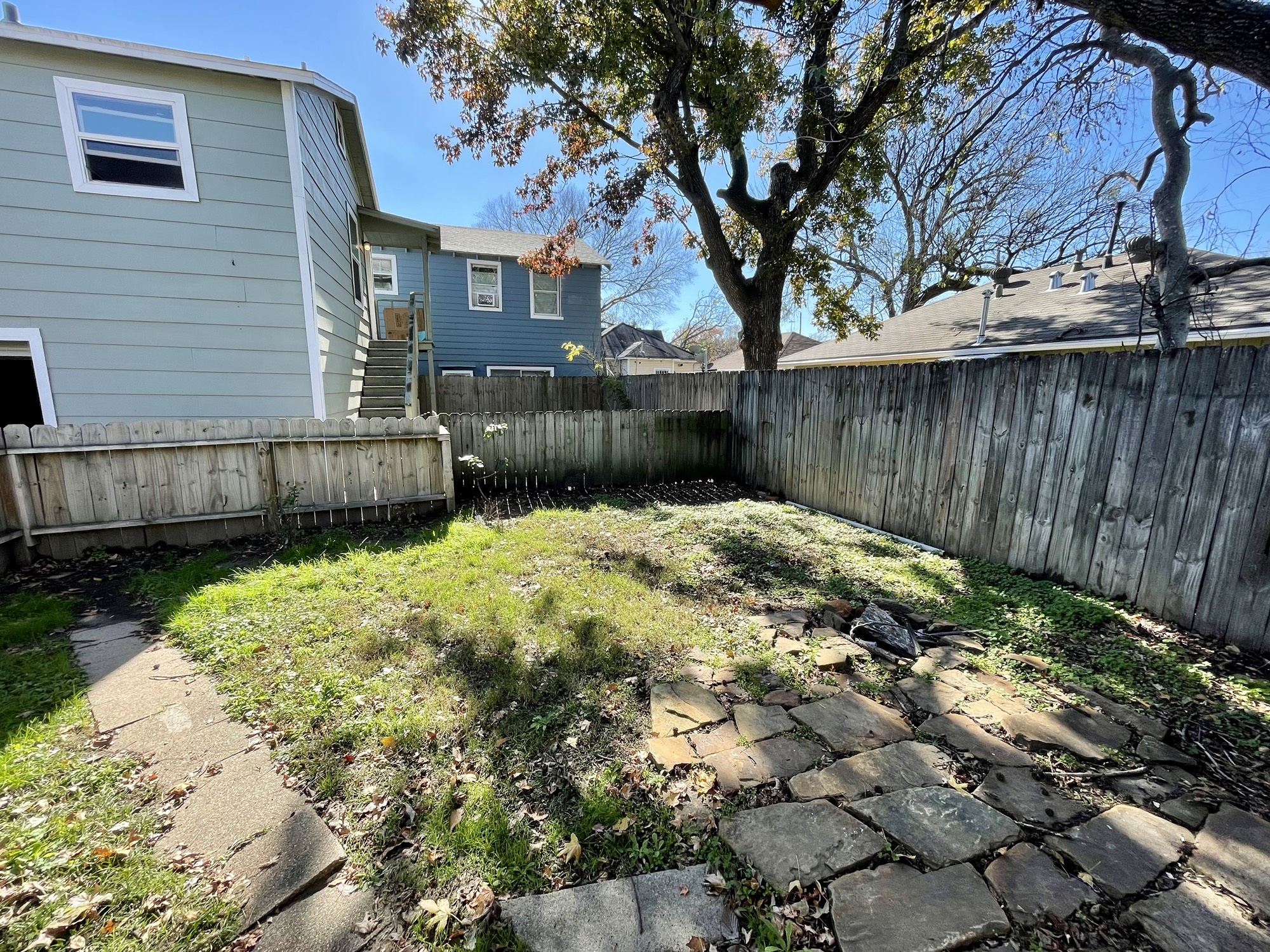 a view of a backyard of the house