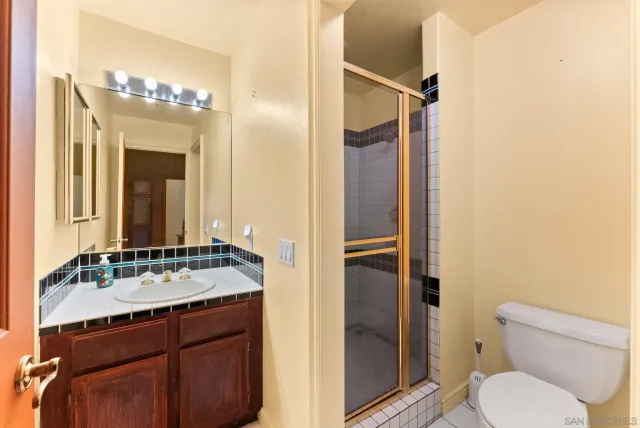 a view of a house with a tree and a forest