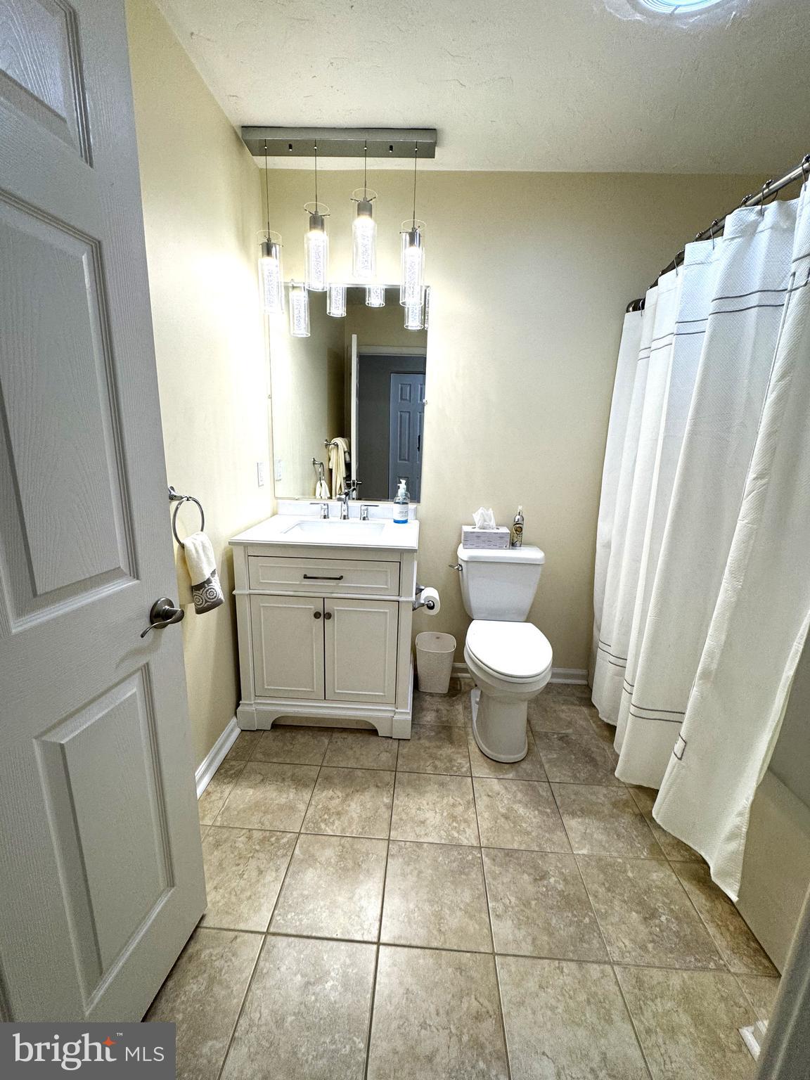 6746 Seneca Ridge Drive York, PA 17403 - Photo 11 of 19 a bathroom with a sink a toilet and a mirror