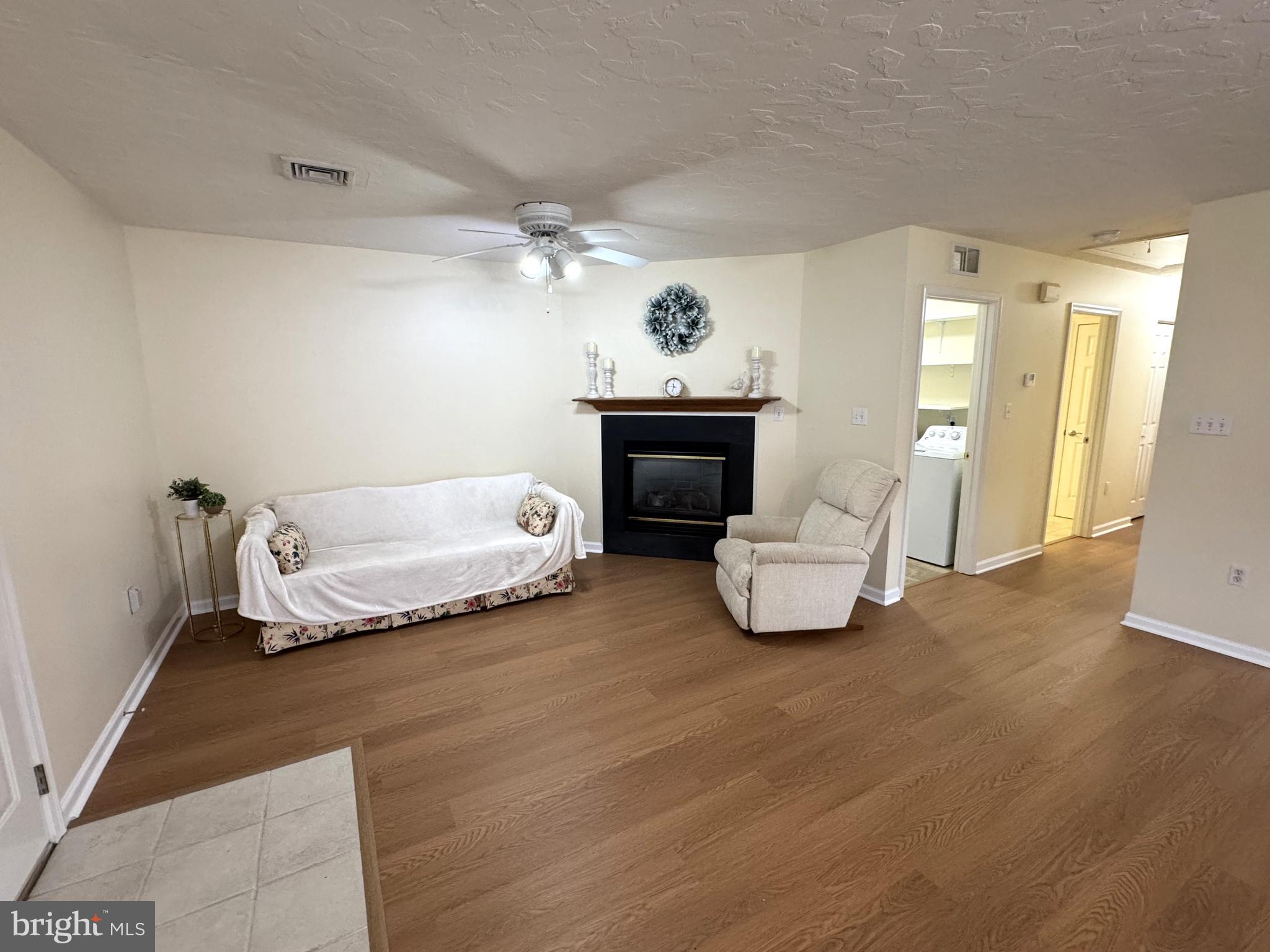 6746 Seneca Ridge Drive York, PA 17403 - Photo 9 of 19 a bedroom with a bed and a chandelier