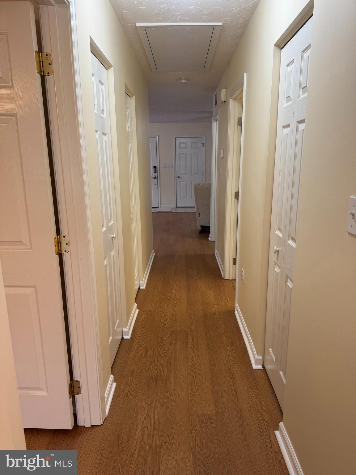 6746 Seneca Ridge Drive York, PA 17403 - Photo 10 of 19 a view of a hallway with wooden floor and staircase