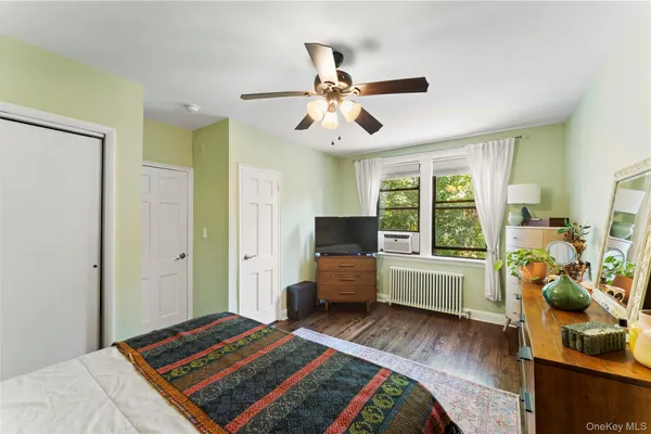 a bedroom with furniture and a window