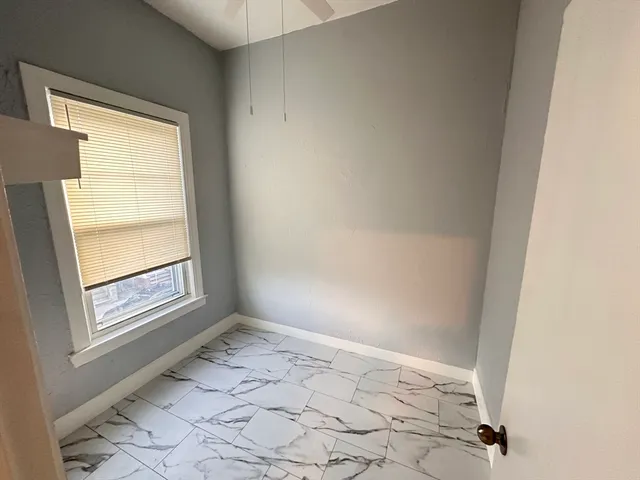 a view of an empty room and window