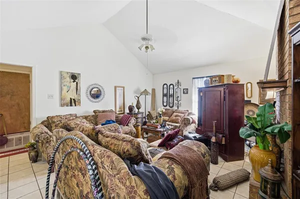 a bed room with a bed and a potted plant