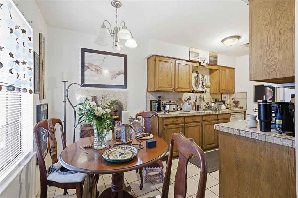 1507 McFerrin Avenue, Unit 9 Waco, TX 76708 - Photo 16 of 26 a dining room with furniture and window