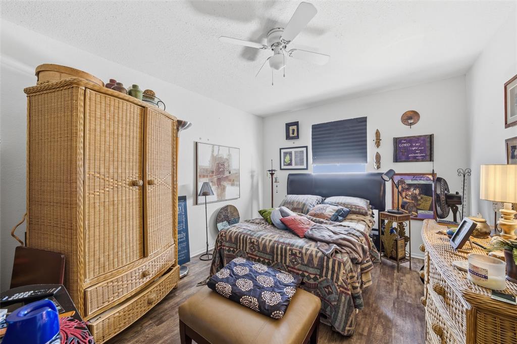 1507 McFerrin Avenue, Unit 9 Waco, TX 76708 - Photo 19 of 26 a bedroom with furniture and a flat screen tv