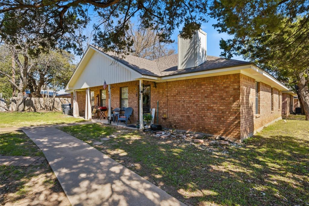 1507 McFerrin Avenue, Unit 9 Waco, TX 76708 - Photo 2 of 26 a front view of a house with garden