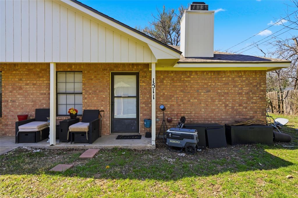1507 McFerrin Avenue, Unit 9 Waco, TX 76708 - Photo 5 of 26 a front view of a house with a yard
