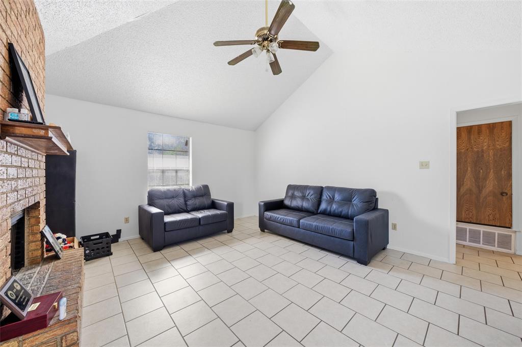 1507 McFerrin Avenue, Unit 9 Waco, TX 76708 - Photo 8 of 26 a living room with furniture and a flat screen tv