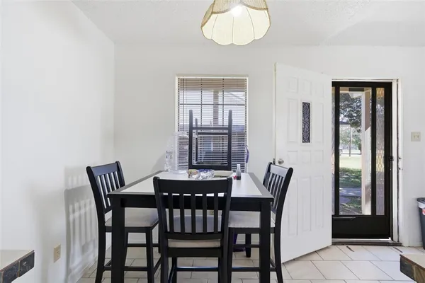a view of a dining room with furniture wooden floor and chandelier