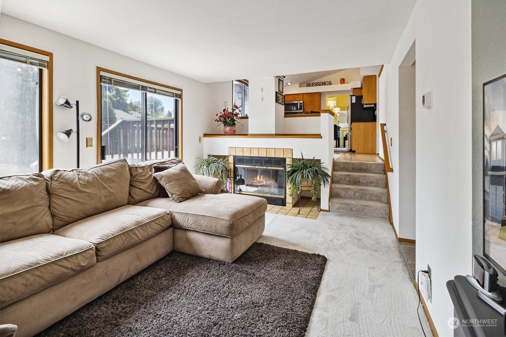 12115 Southeast 280th Street Kent, WA 98030 - Photo 15 of 40 a living room with furniture and a fireplace