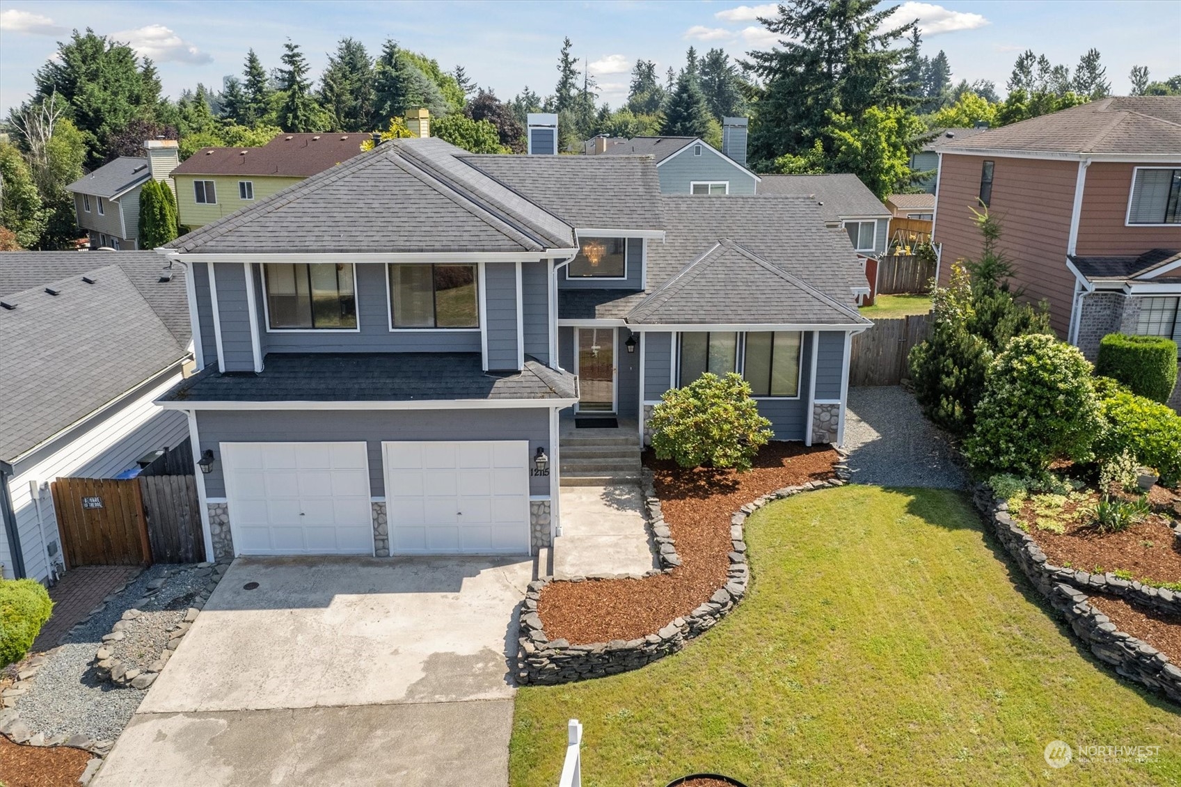 12115 Southeast 280th Street Kent, WA 98030 - Photo 18 of 40 a view of a white house with a swimming pool and wooden fence