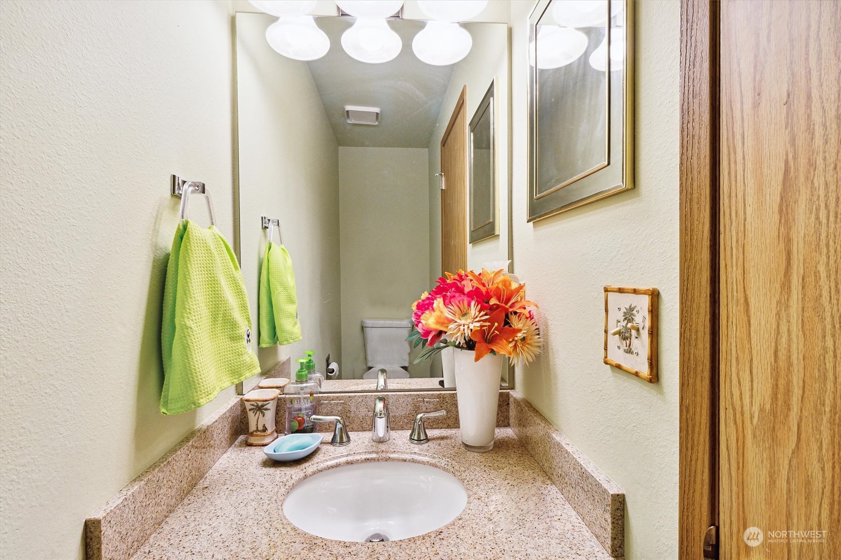 12115 Southeast 280th Street Kent, WA 98030 - Photo 19 of 40 a bathroom with a granite countertop sink a mirror and a shower curtain