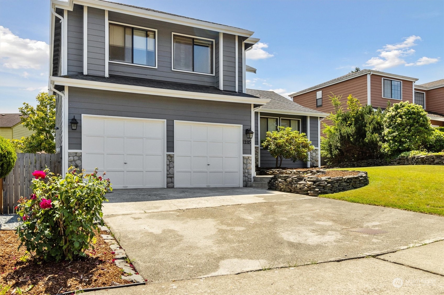 12115 Southeast 280th Street Kent, WA 98030 - Photo 20 of 40 a front view of a house with a yard and garage