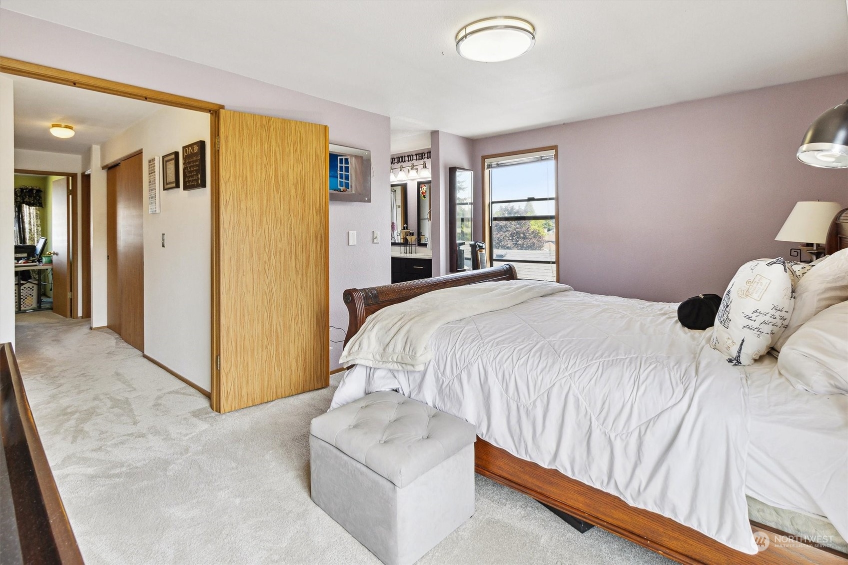 12115 Southeast 280th Street Kent, WA 98030 - Photo 24 of 40 a spacious bedroom with a bed and cabinets