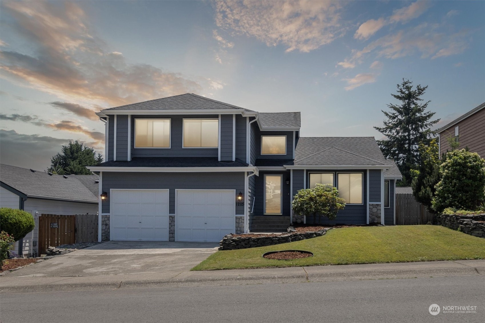 12115 Southeast 280th Street Kent, WA 98030 - Photo 26 of 40 a house view with a garden space