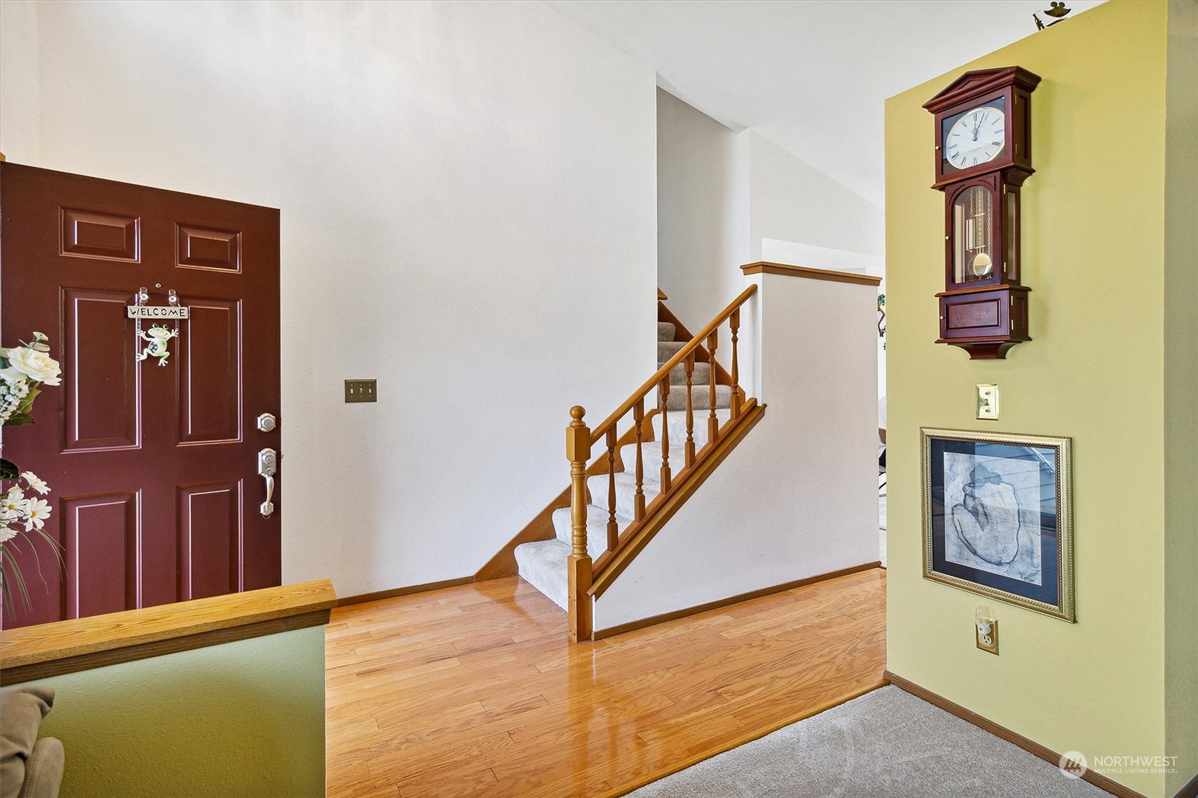 12115 Southeast 280th Street Kent, WA 98030 - Photo 3 of 40 a view of hallway with stairs and wooden floor