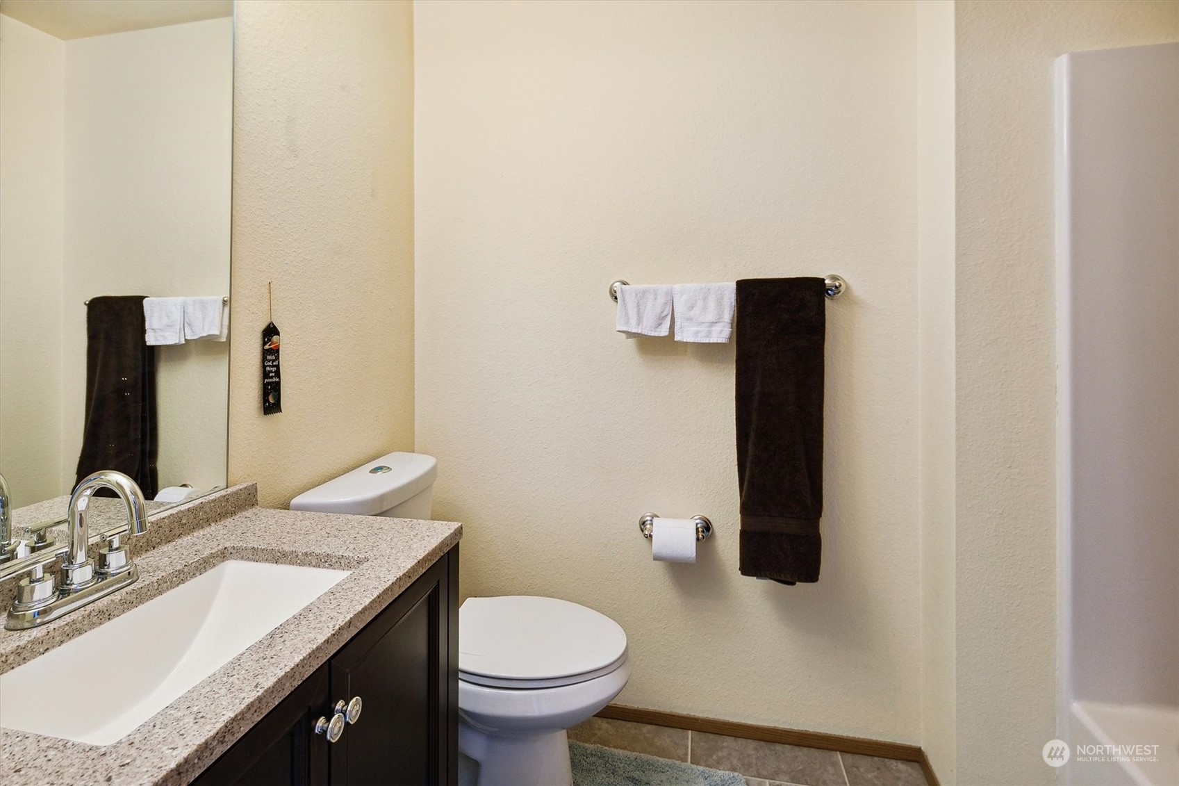 12115 Southeast 280th Street Kent, WA 98030 - Photo 31 of 40 a bathroom with a granite countertop toilet sink and mirror