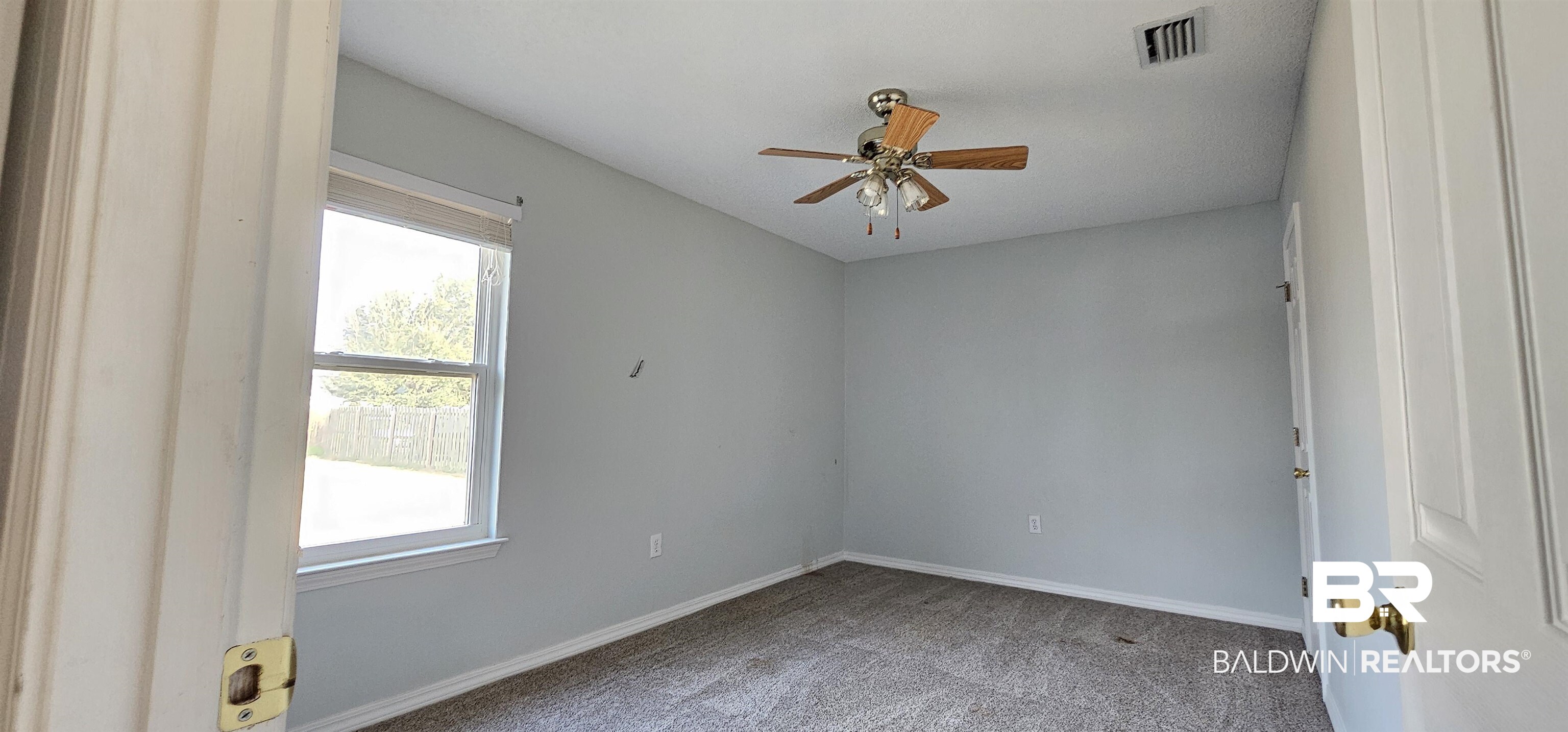 8940 Shannon's Mill Road Foley, AL 36535 - Photo 29 of 35 Spare room featuring ceiling fan and light colored carpet