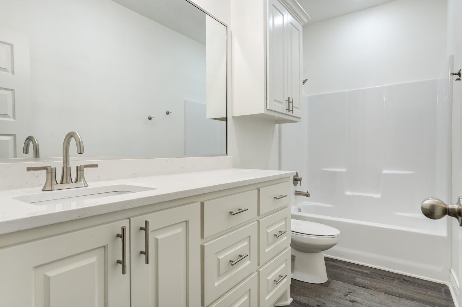 3712 144th Street Lubbock, TX 79423 - Photo 33 of 46 a bathroom with a sink toilet and shower