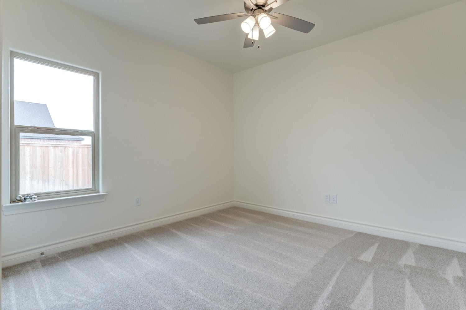 3712 144th Street Lubbock, TX 79423 - Photo 35 of 46 an empty room with a window