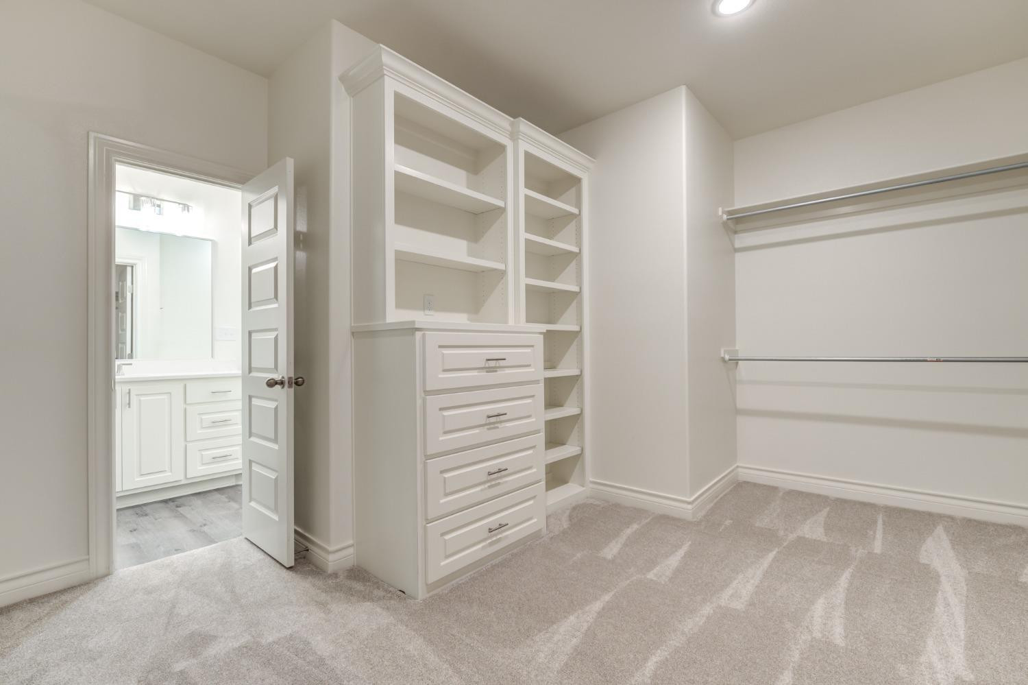 3712 144th Street Lubbock, TX 79423 - Photo 43 of 46 a view of walk in closet with empty racks