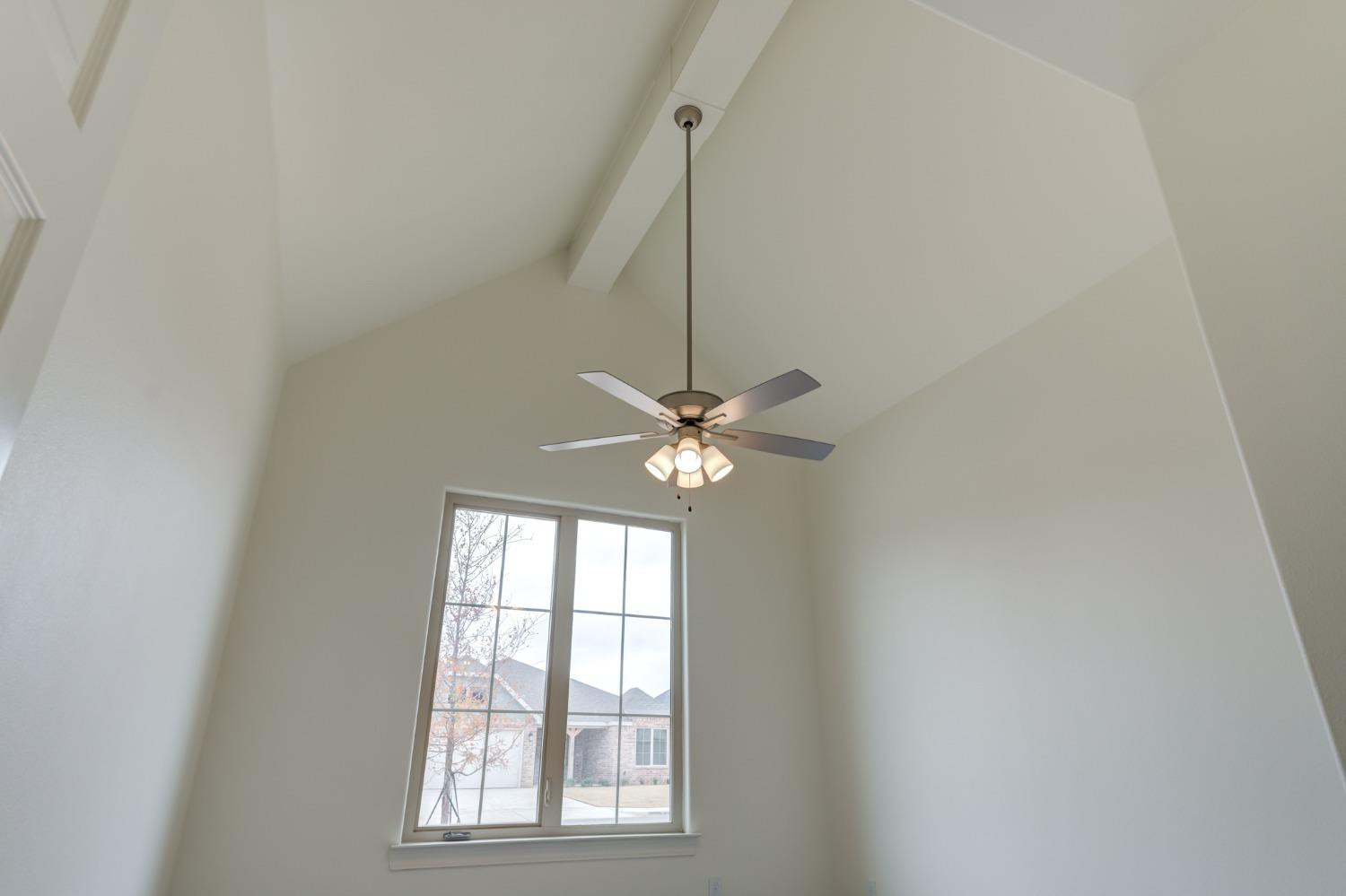 3712 144th Street Lubbock, TX 79423 - Photo 5 of 46 a a room with a window and ceiling fan