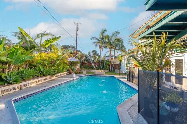 a view of a backyard with swimming pool