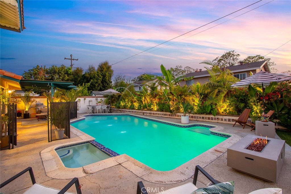 2718 North Wright Street Santa Ana, CA 92705 - Photo 39 of 45 a view of a swimming pool with a lounge chairs