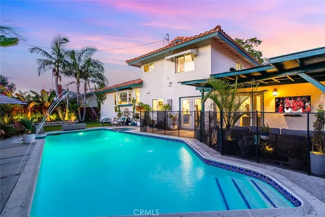 a view of a house with swimming pool
