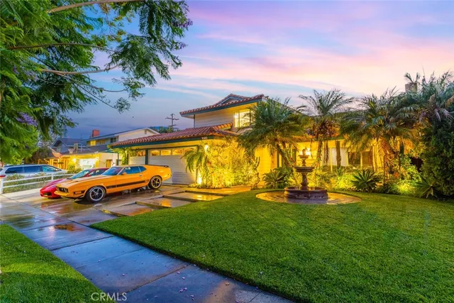 an ocean view with lawn chairs and a big yard