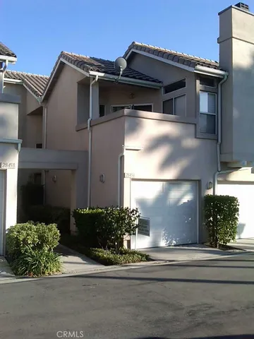 a view of a house with a flower garden