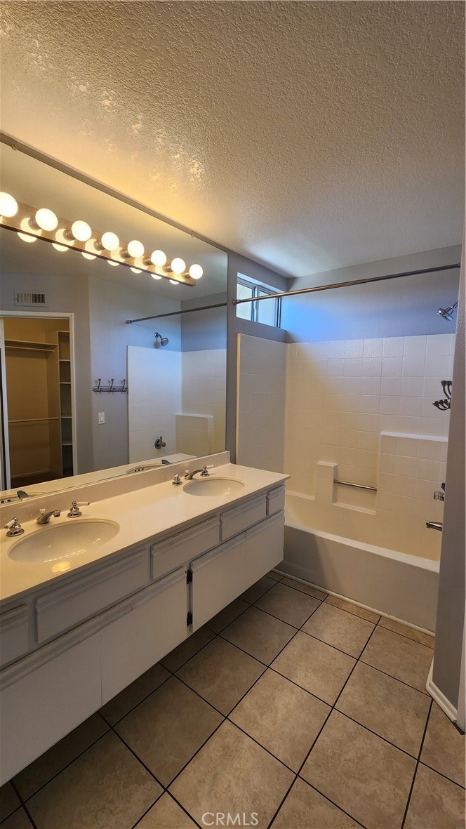 28456 Yosemite Drive Lake Forest, CA 92679 - Photo 20 of 33 a bathroom with a bathtub sink and mirror