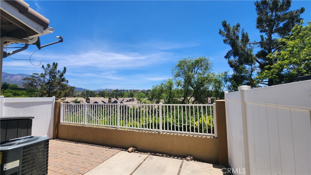 28456 Yosemite Drive Lake Forest, CA 92679 - Photo 28 of 33 a view of a balcony with wooden floor and fence