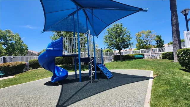 a kitchen with a refrigerator and a stove