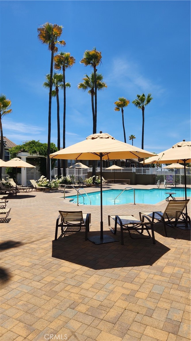28456 Yosemite Drive Lake Forest, CA 92679 - Photo 30 of 33 a view of a swimming pool with a table and chairs