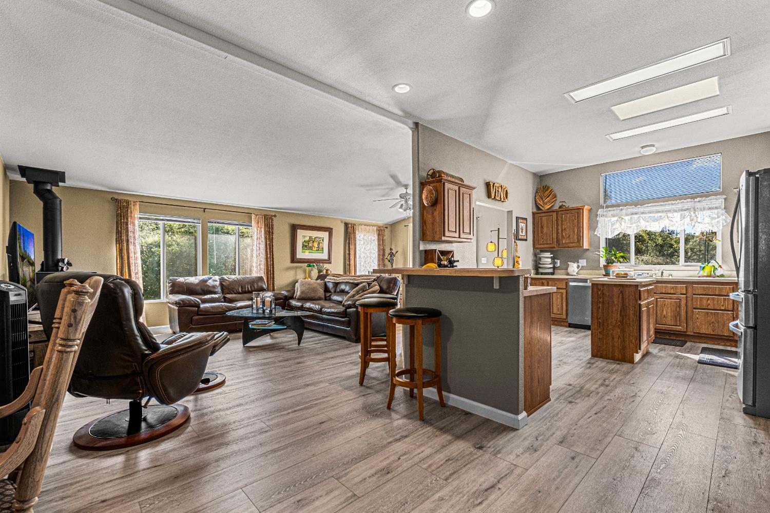 9425 Mosquito Road Placerville, CA 95667 - Photo 26 of 74 a living room with furniture a window wooden floor and a table