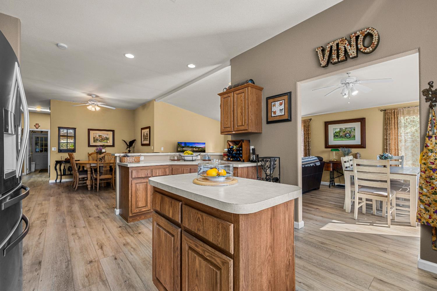 9425 Mosquito Road Placerville, CA 95667 - Photo 31 of 74 a kitchen with stainless steel appliances granite countertop a stove top oven a sink a dining table and chairs with wooden floor