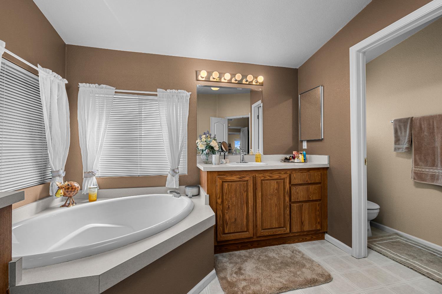 9425 Mosquito Road Placerville, CA 95667 - Photo 41 of 74 a spacious bathroom with a tub sink and mirror