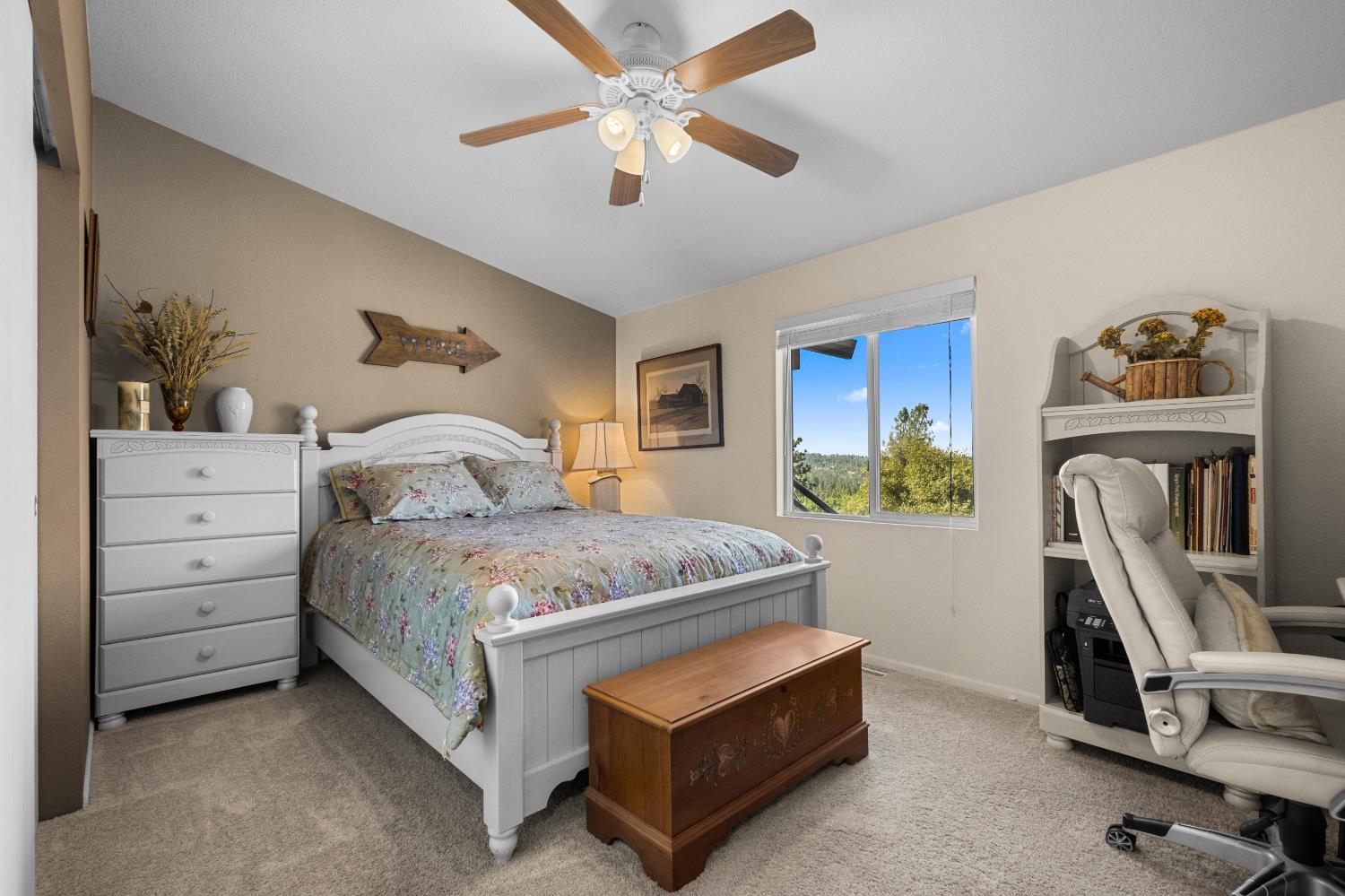 9425 Mosquito Road Placerville, CA 95667 - Photo 42 of 74 a bedroom with a bed a couch and a chandelier