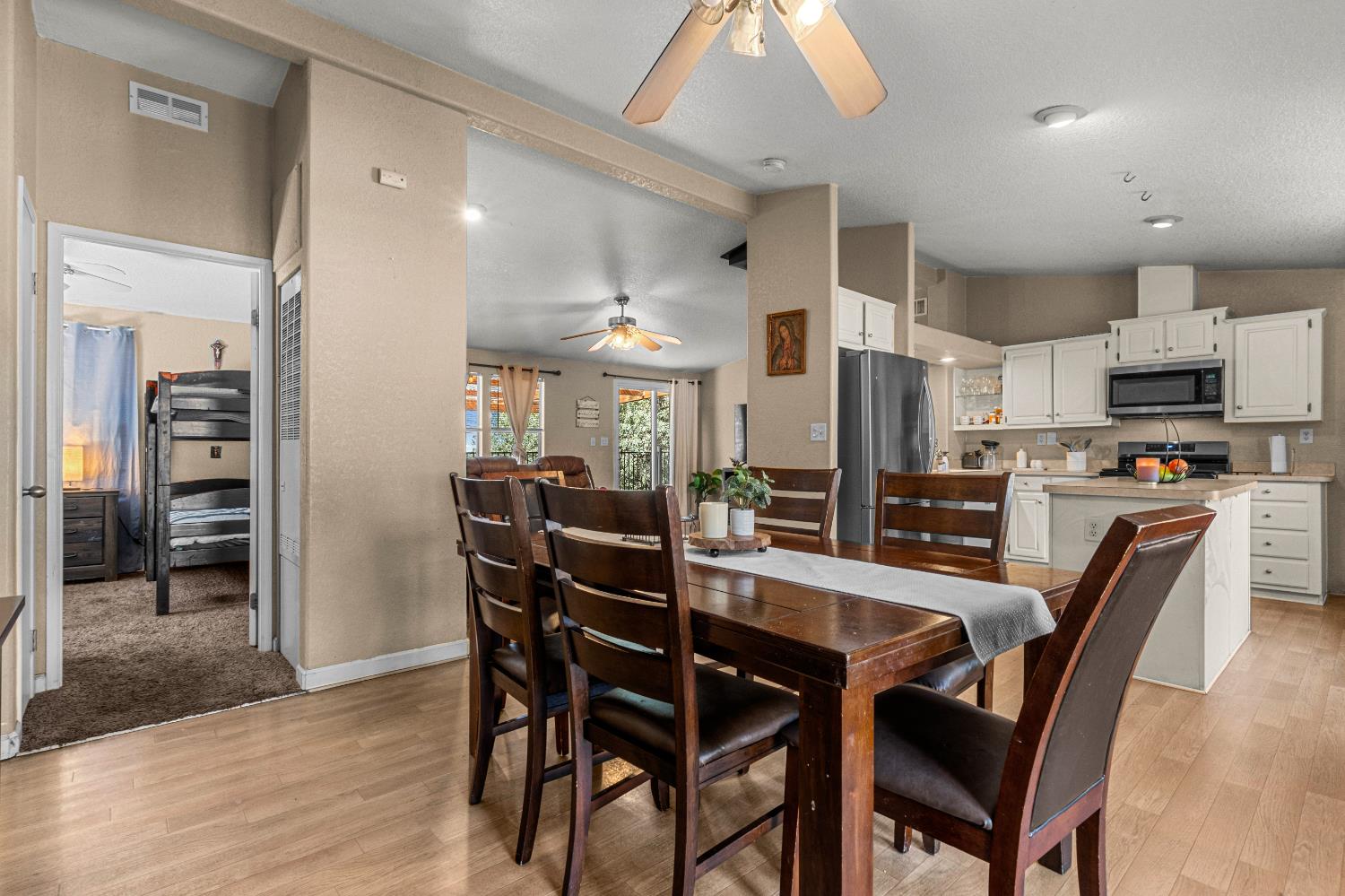 9425 Mosquito Road Placerville, CA 95667 - Photo 53 of 74 a dining area with stainless steel appliances kitchen island granite countertop a dining table chairs and a refrigerator