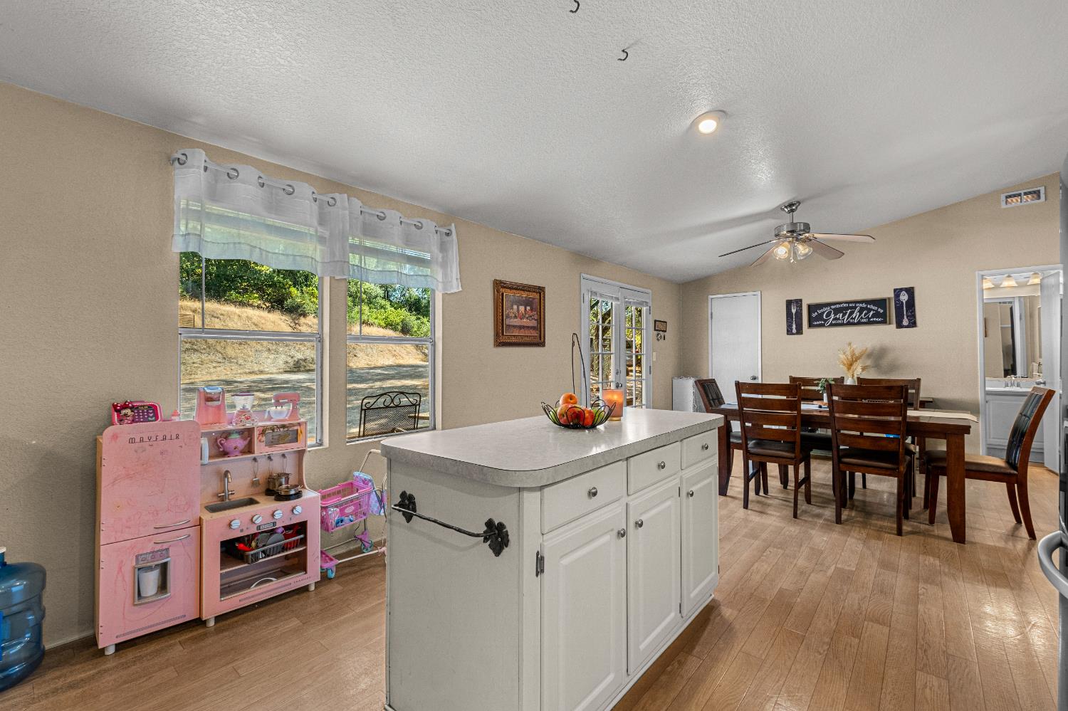 9425 Mosquito Road Placerville, CA 95667 - Photo 57 of 74 a view of a center kitchen island furniture and windows