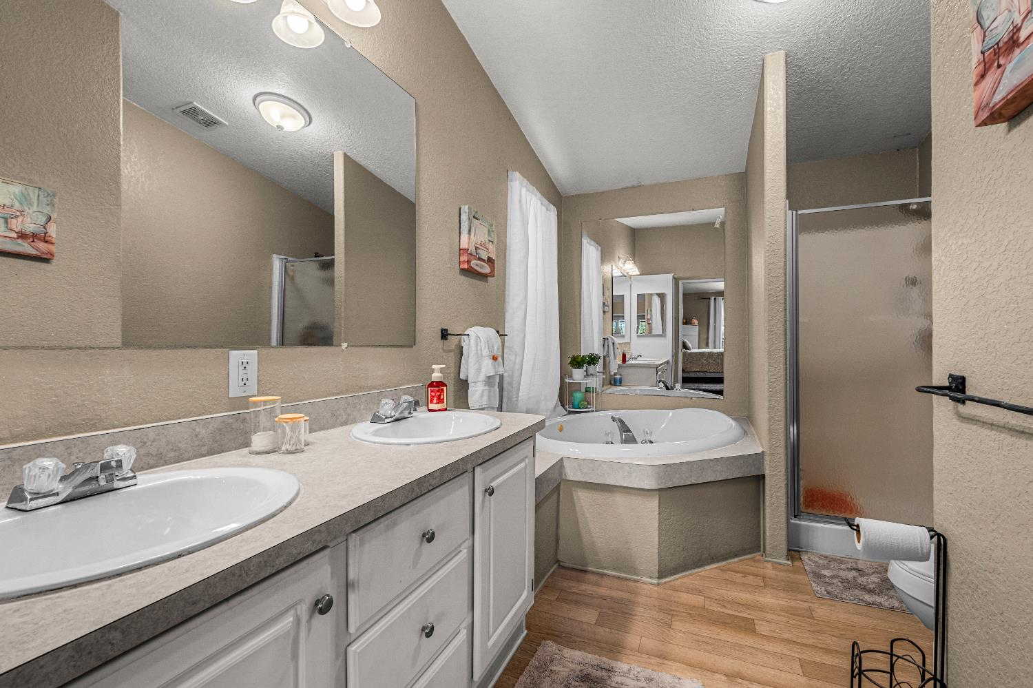 9425 Mosquito Road Placerville, CA 95667 - Photo 62 of 74 a bathroom with a sink double vanity granite tub and a mirror