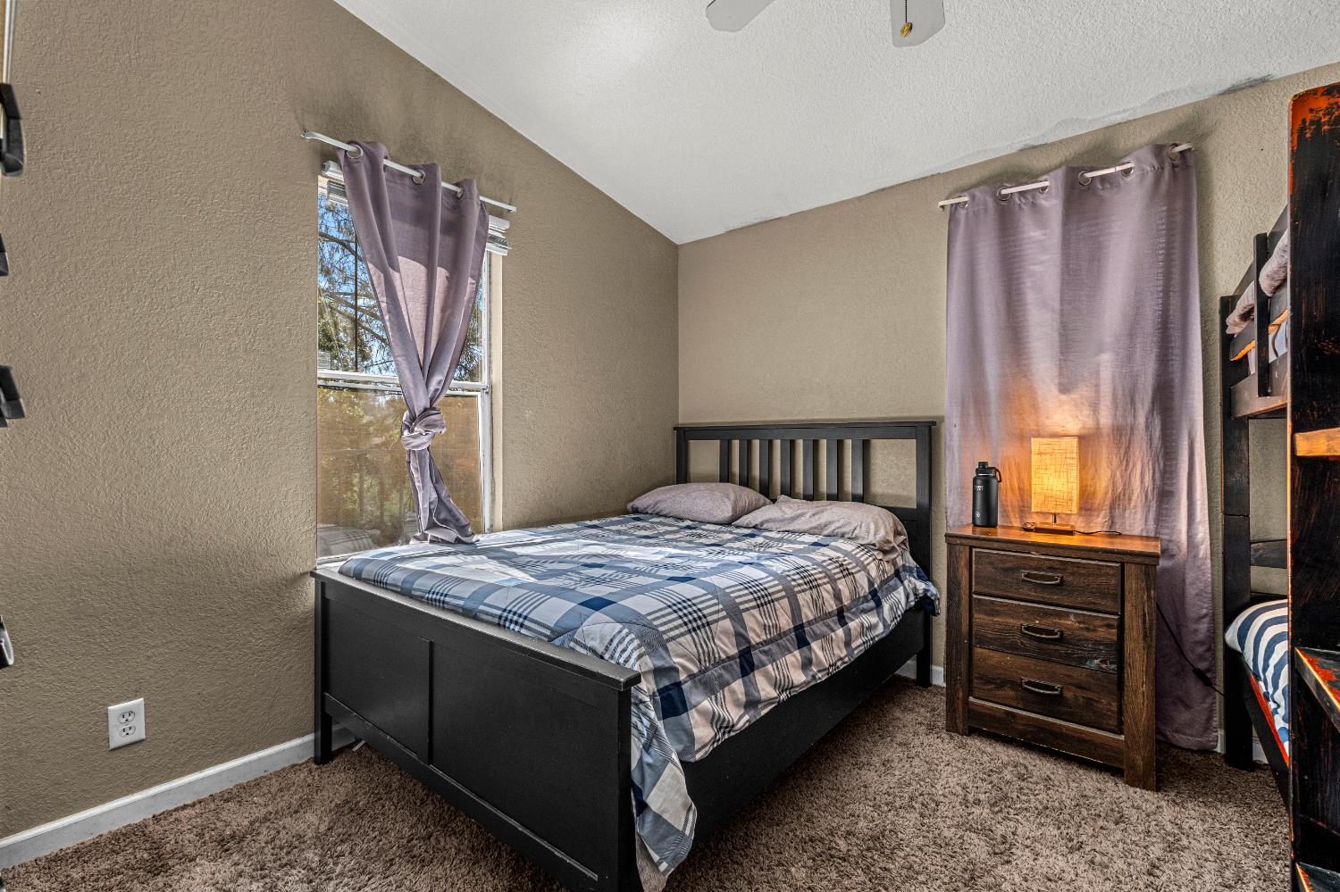 9425 Mosquito Road Placerville, CA 95667 - Photo 64 of 74 a bedroom with a bed next to a window