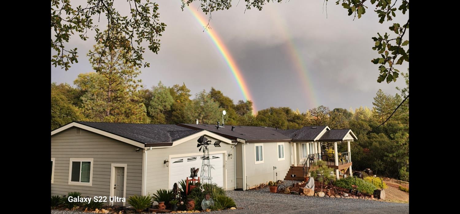 9425 Mosquito Road Placerville, CA 95667 - Photo 72 of 74 a view of a house with a small yard and potted plants
