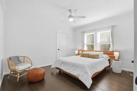 a bedroom with a bed and window